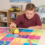 Bee-Bot® on a colorful learning mat.